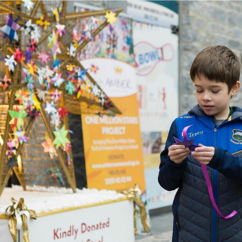Olli Morris, choosing a woven star to tie to the custom
steel letters by JM Steel Kilkenny created for
Amber Women's Refuge stars at MacDonagh Junction. Ireland.